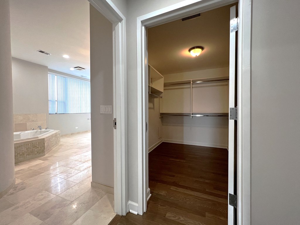 a view of a bathroom and a living room from a doorway