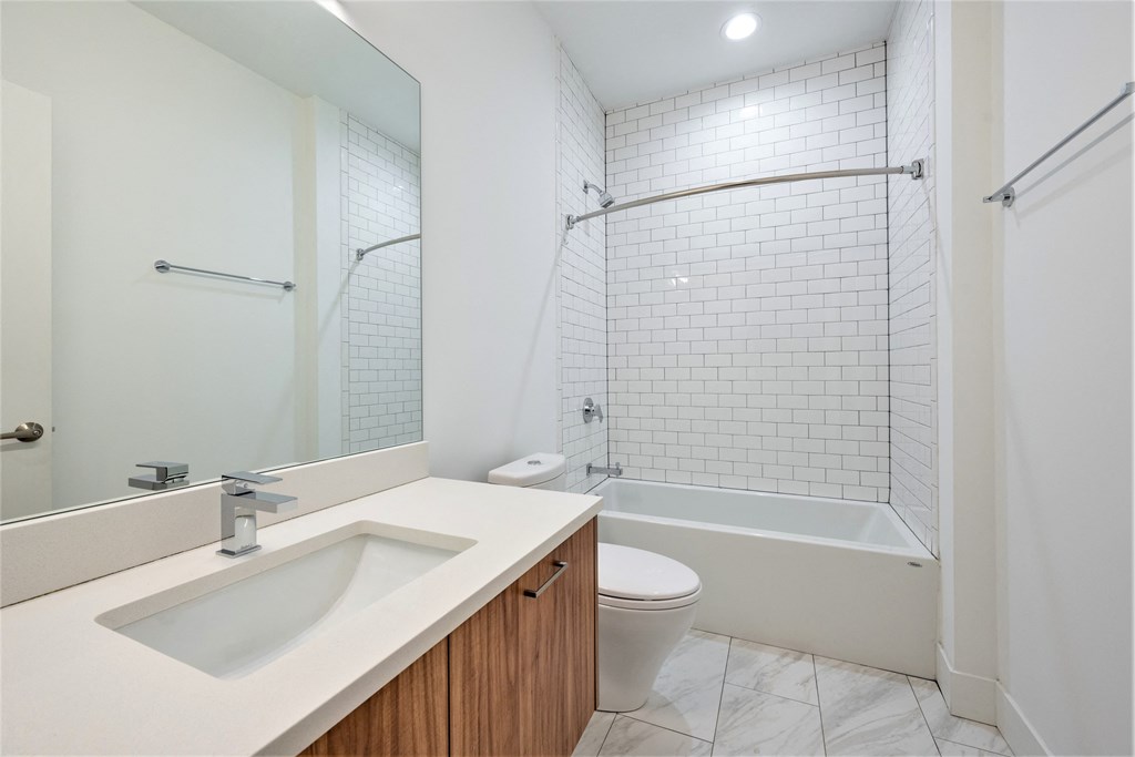 a bathroom with a sink and a shower and a toilet at Wilmette 1121, Wilmette, IL