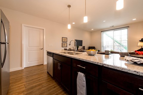 a kitchen with a counter top and a sink