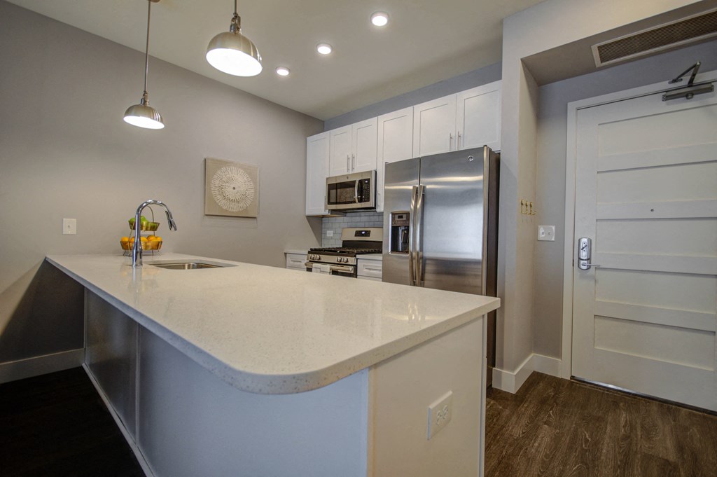 a kitchen with an island and a stainless steel refrigerator at Barrington 101, Barrington, 60010