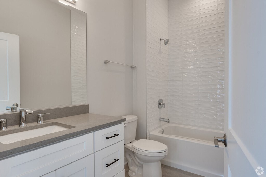 a bathroom with a sink toilet and a tub  at Highwood 246, Highwood, 60040