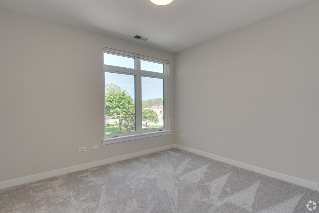 an empty living room with a large window  at Highwood 246, Highwood, Illinois