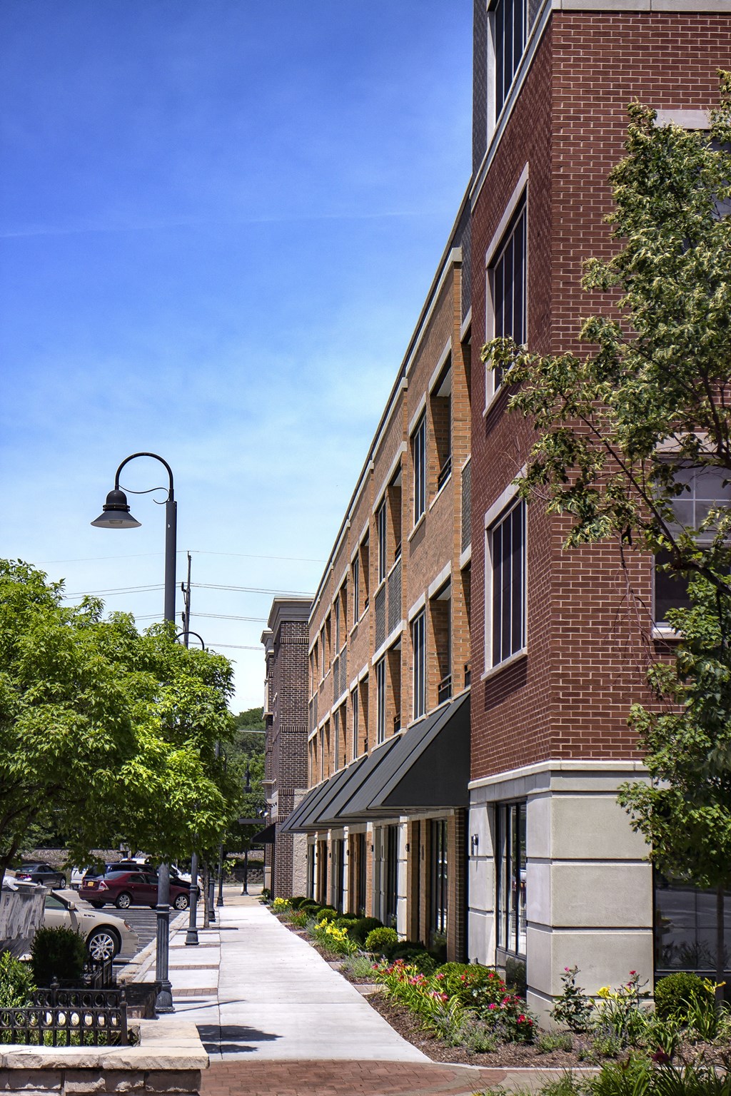 a large brick building with a sidewalk in front of it at Clarendon Hills 229, Clarendon Illinois