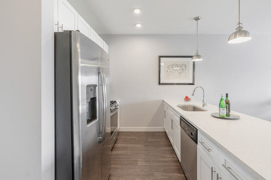 a kitchen with stainless steel appliances and white cabinets at Barrington 101, Barrington, IL