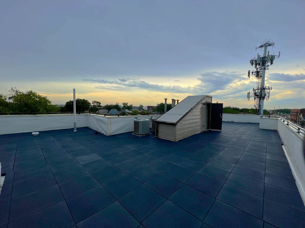 the roof of a building with a sunset in the background  at Elston 3434, Chicago, Illinois