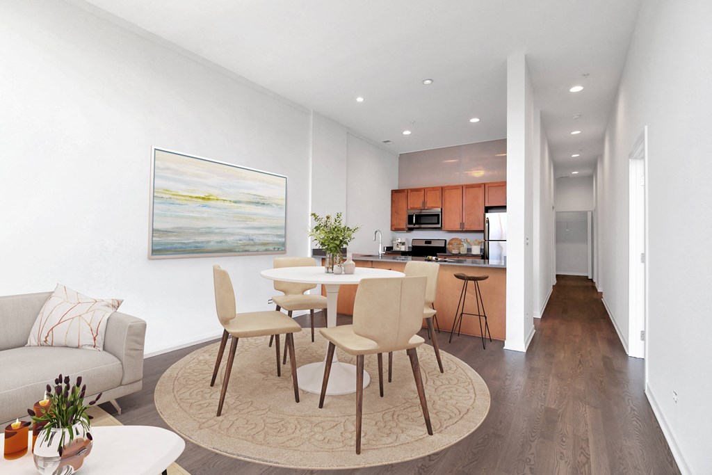 a living room and kitchen with a table and chairs  at Fullerton 1540, Chicago, IL