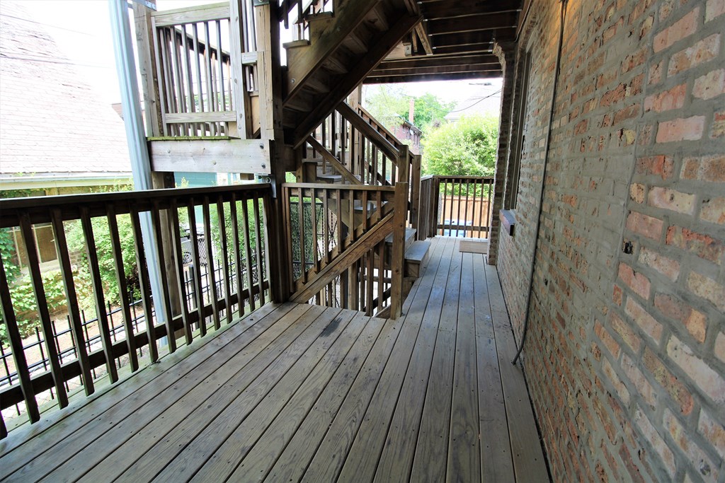a view of the upstairs deck from the side of the house at Tripp 4321, Illinois