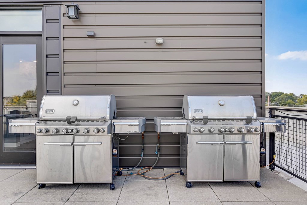 two stainless steel gas grills in front of a building at Barrington 101, Barrington, IL 60010
