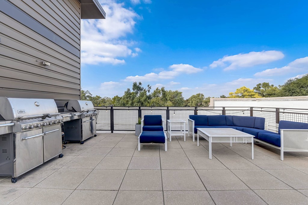 a patio with a grill and a table and chairs at Barrington 101, Illinois, 60010