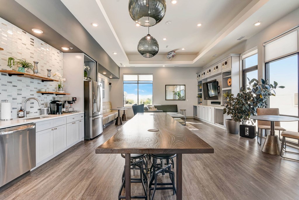 a large kitchen and dining room with a large wooden table at Barrington 101, Barrington Illinois