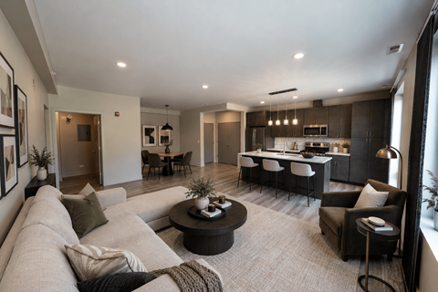 A modern living room with a grey sofa and a coffee table.