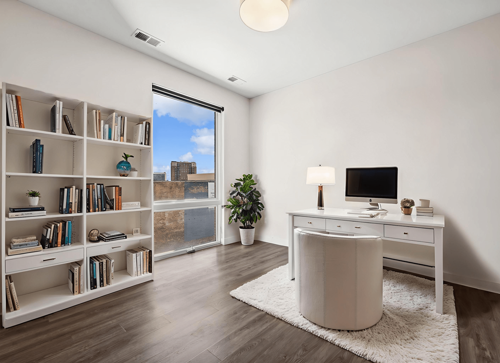 Home office at Highpoint Buena Park on Broadway with floor-to-ceiling windows and city views in a bright, modern apartment in Chicago’s Buena Park neighborhood