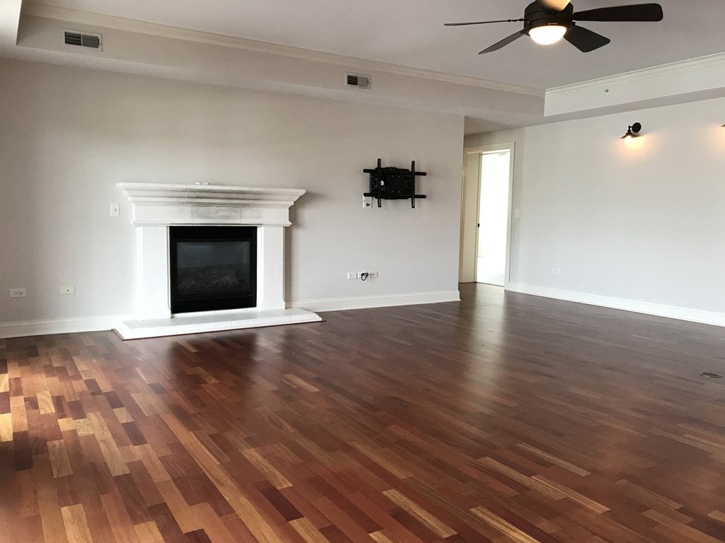 a living room with a fireplace and wooden floors  at Countryside 10765, Illinois