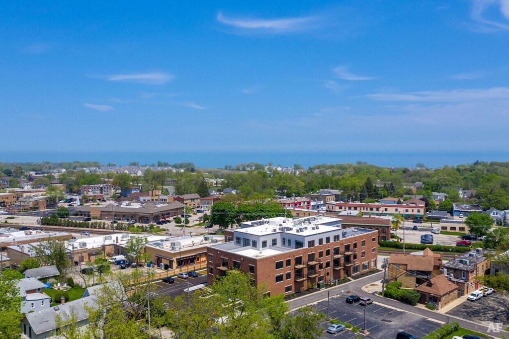an aerial view of a city with buildings and the ocean in the background  at Highwood 246, Highwood, Illinois