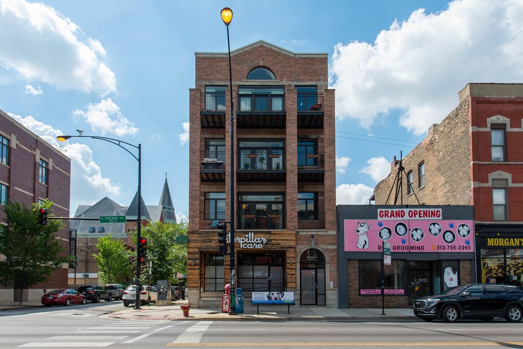 a brick building on the corner of a city street at West Chicago 1701, Chicago
