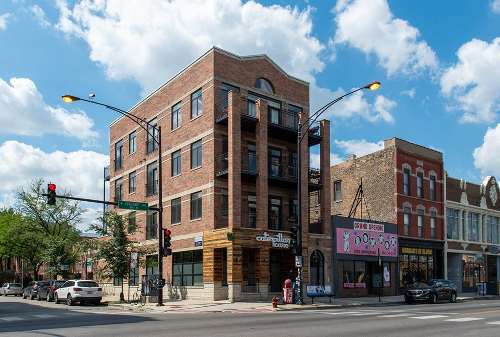 a brick building on the corner of a city street at West Chicago 1701, Illinois