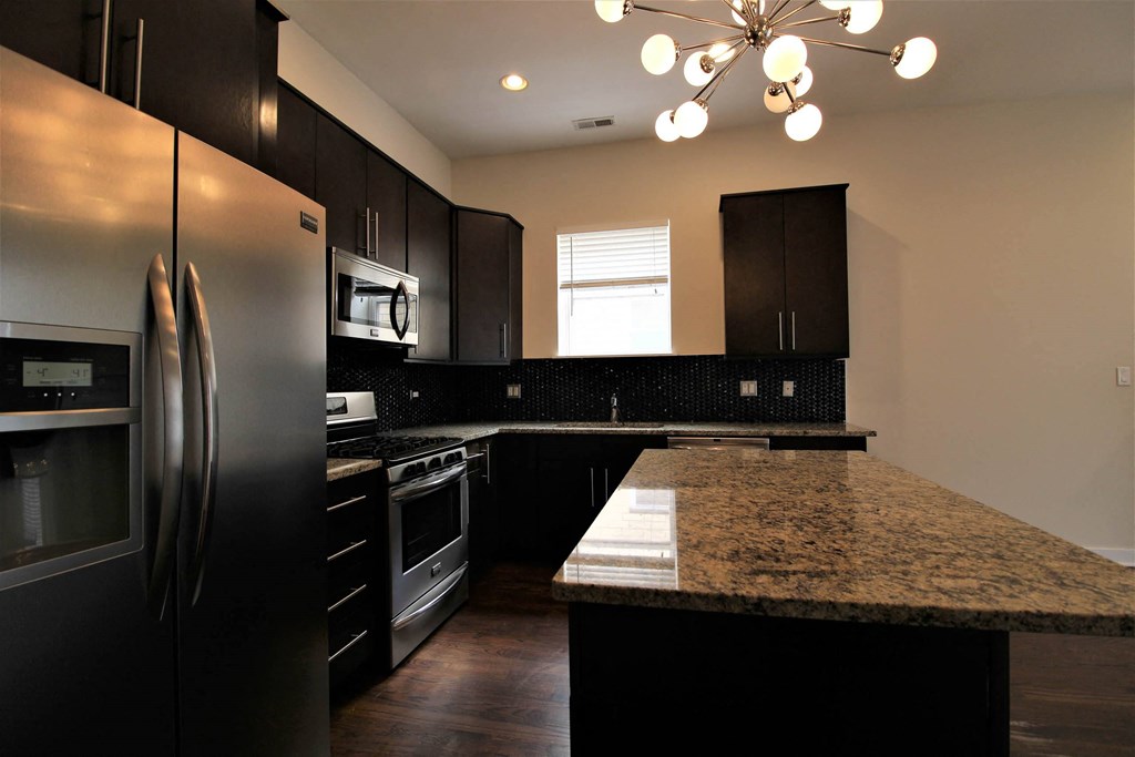 a kitchen with stainless steel appliances and granite counter tops at Montrose 3634, Chicago, IL 60618