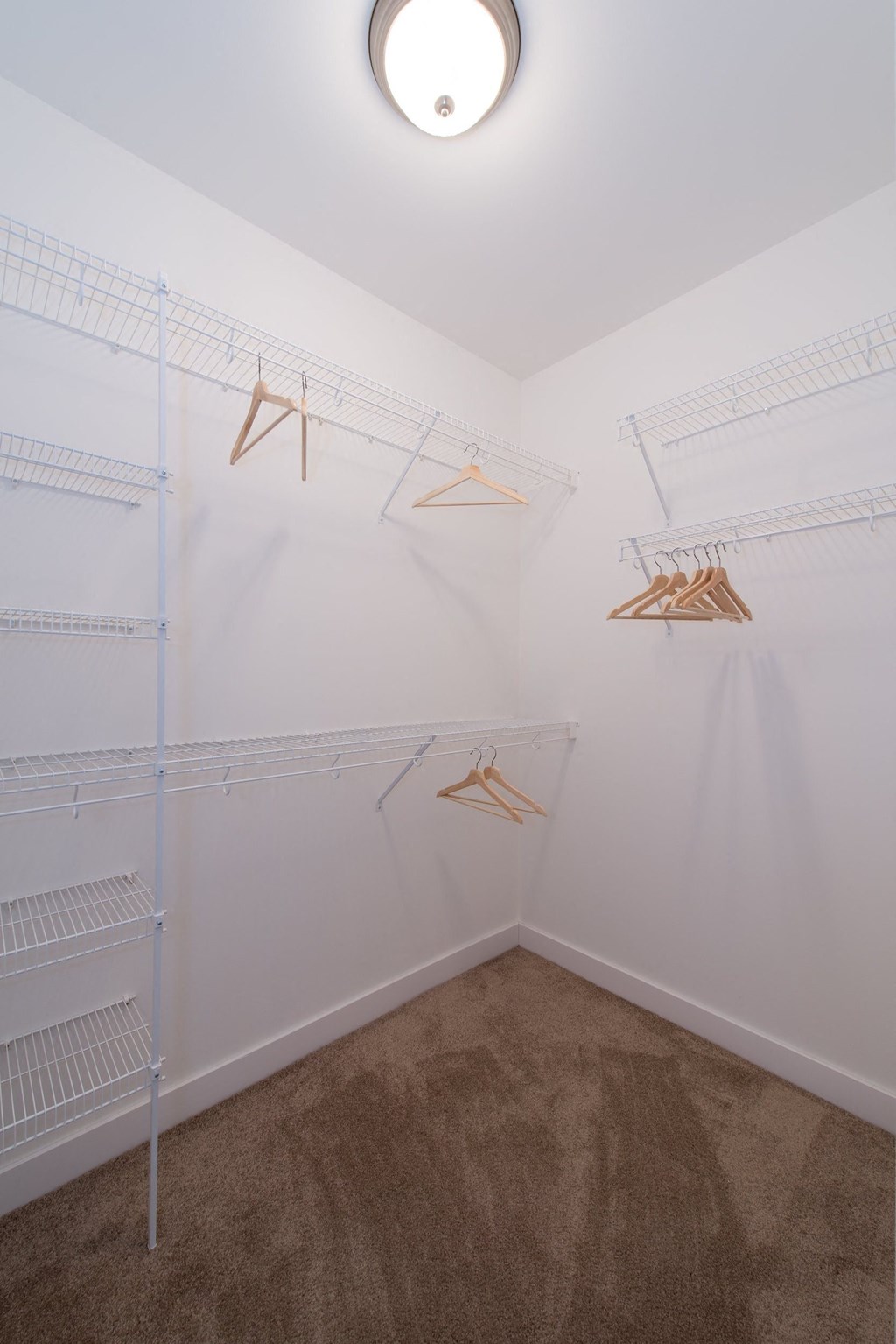 a closet in a room with white walls and carpet  at Kedzie 4447, Chicago, IL
