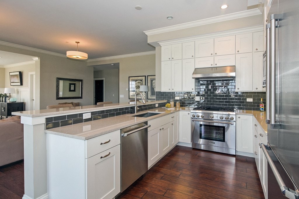 a large kitchen with white cabinets and stainless steel appliances  at Countryside 10765, Countryside, IL, 60525
