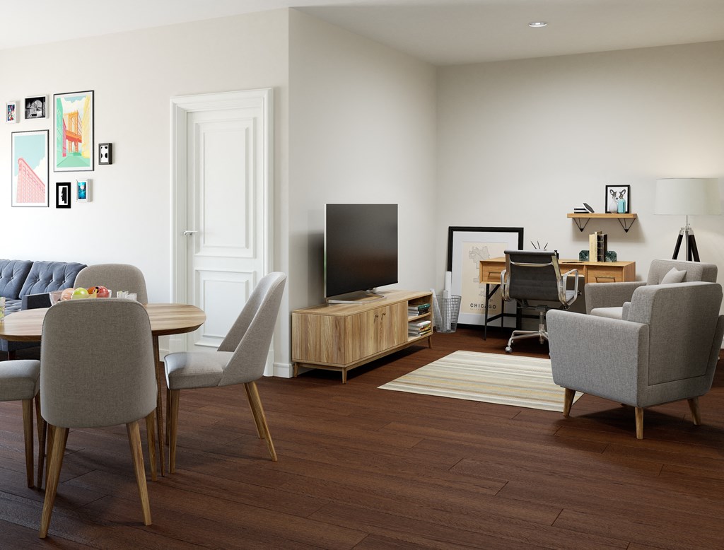 a living room with a table and chairs and a television  at Kedzie 4447, Chicago, 60625