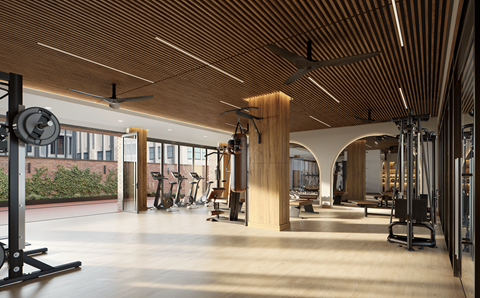 A gym with a variety of equipment including treadmills, weights, and exercise machines.