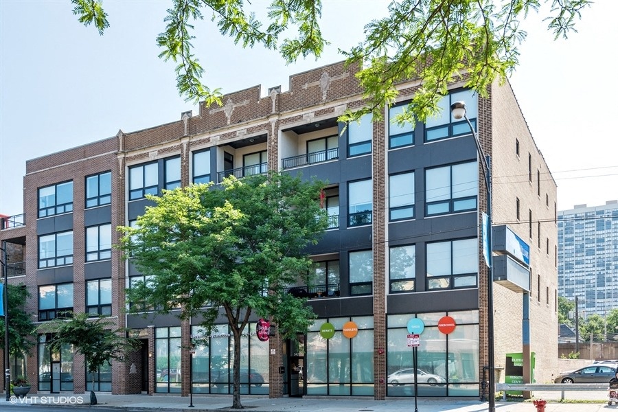 a large brick building with trees in front of it