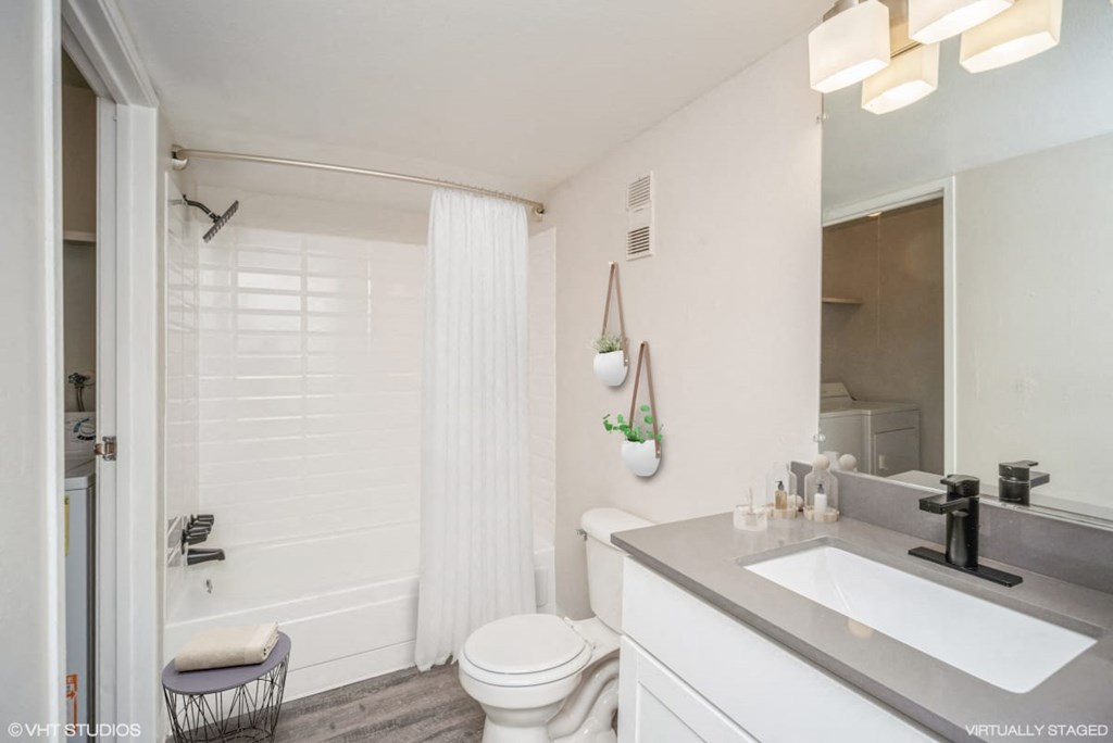 Bathroom with a sink and a toilet  at Avery Park in Englewood, CO