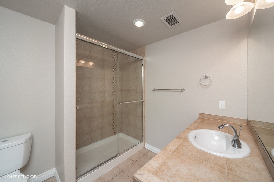 Bathroom with shower that has a nice glass door