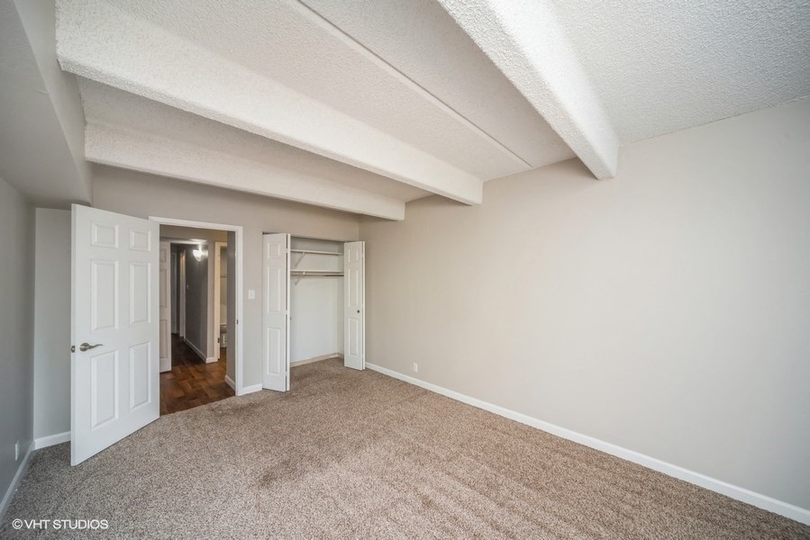 Bedroom with a large closet at 878 S Dexter St in Denver, CO