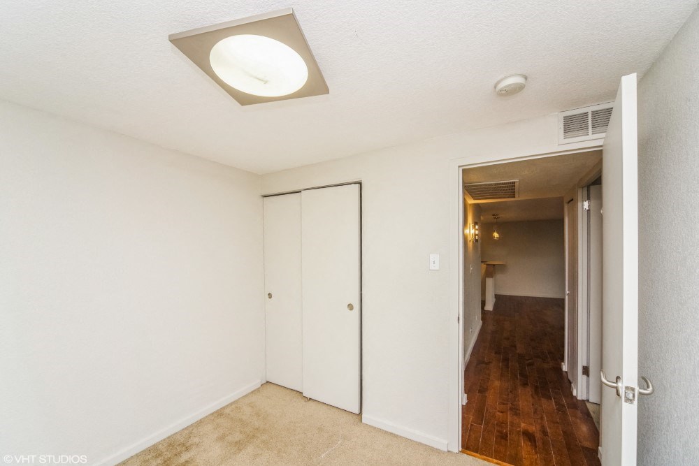Bedroom with plush carpeting