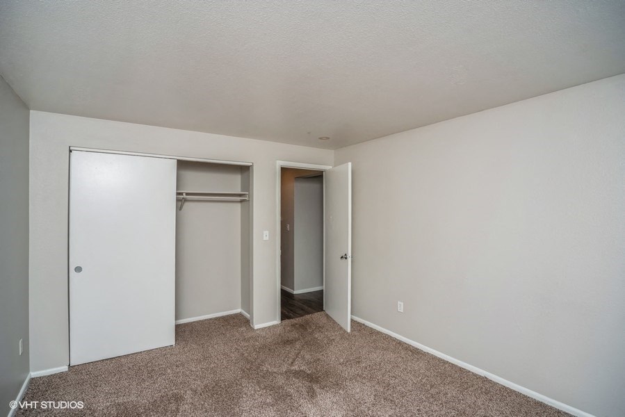 Bedroom with plush carpeting