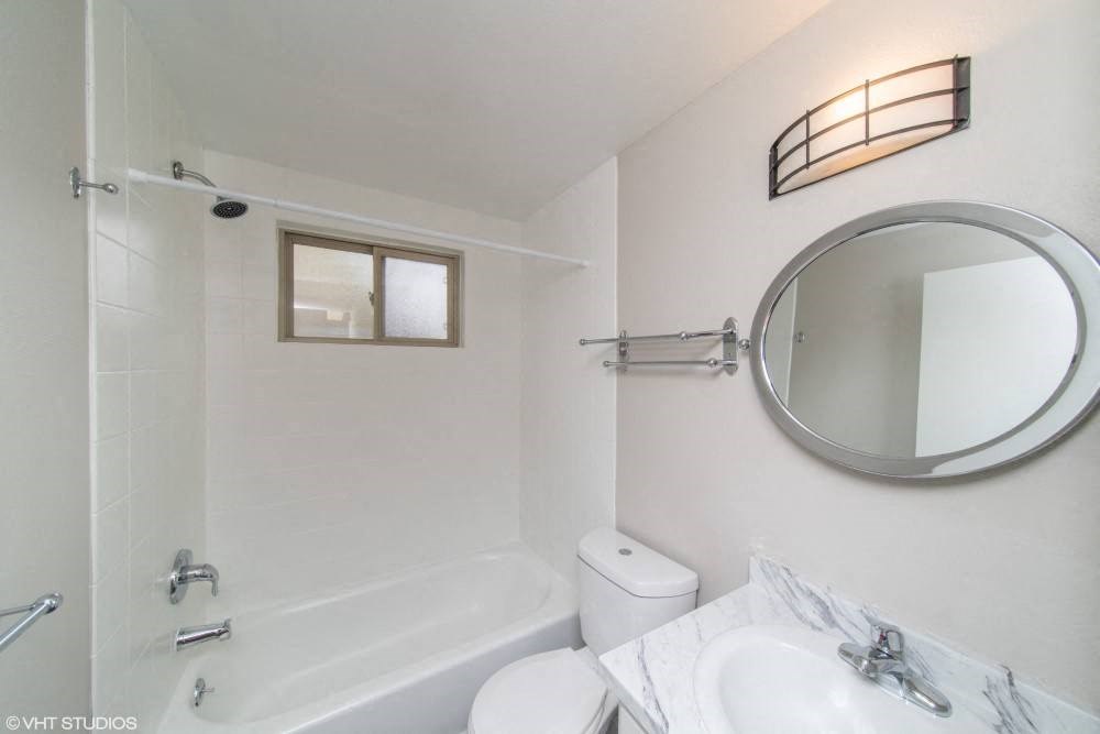 Renovated bathroom with granite countertop