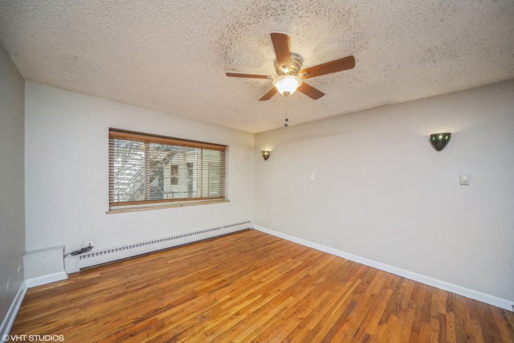 Large windows and rich hardwood flooring at 1355 Pearl in Denver, CO