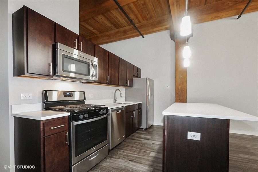 Breathtaking kitchen space with a floating islandat Carriage House Lofts, Chicago, IL, 60605