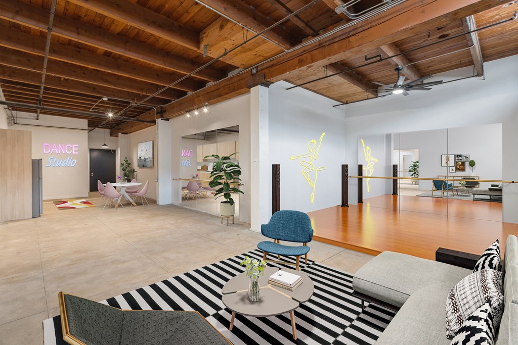 A dance studio is located in the back of this open plan office space.