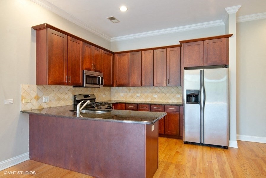 Kitchen with stainless steel appliances - 2 Bedroom