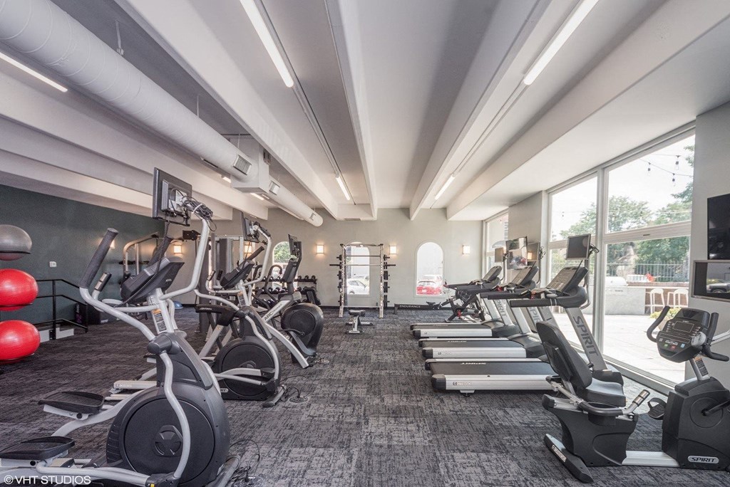 A gym with treadmills, exercise bikes, and other equipment at 878 S Dexter St in Denver, CO