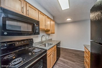 Plenty of counter space and rich wood-like flooring Plenty of counter space and rich wood-like flooring - Photo Gallery 3
