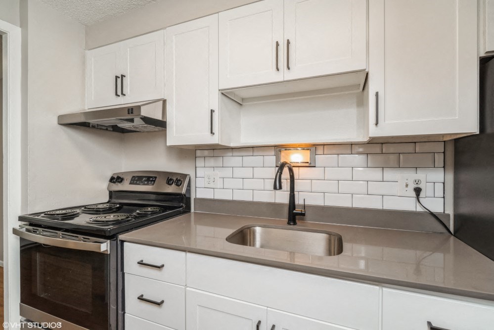 Renovated kitchen with subway tile backsplash