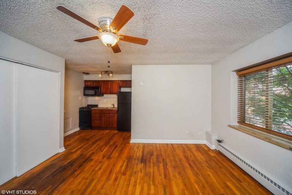 Living room with hardwood flooring and a ceiling fan at 1355 Pearl in Denver, CO