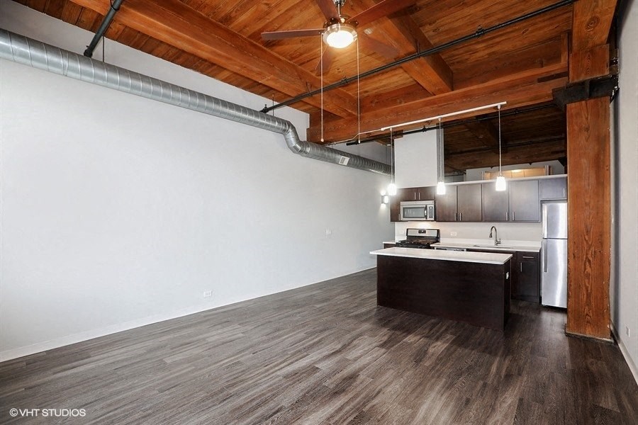 Open concept living space at Carriage House Lofts, Illinois, 60605