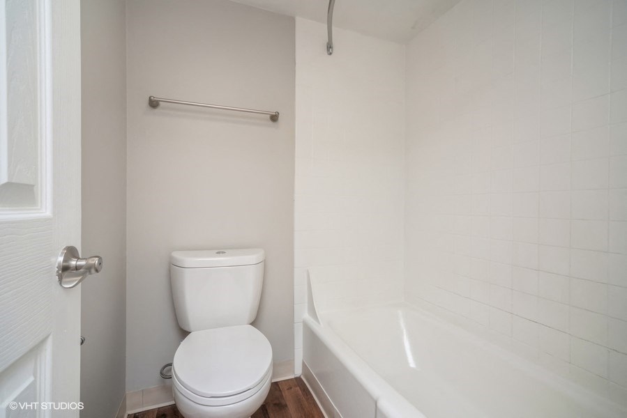 Toilet room with tiled shower at 878 S Dexter St in Denver, CO