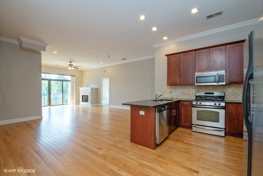 Open layout with sightlines to the living area from the kitchen - 2 Bedroom