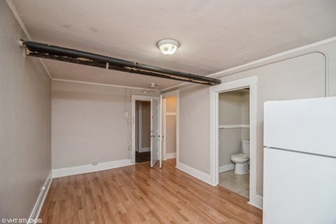 Living area with neutral color scheme 1170 N Logan St in Denver, CO