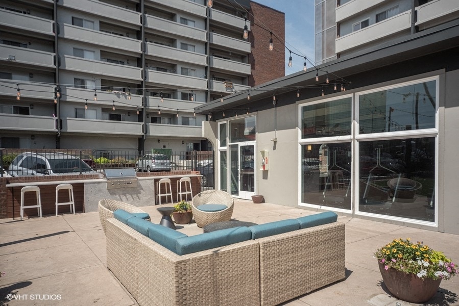 Upgraded shared patio space with grills and outdoor seating