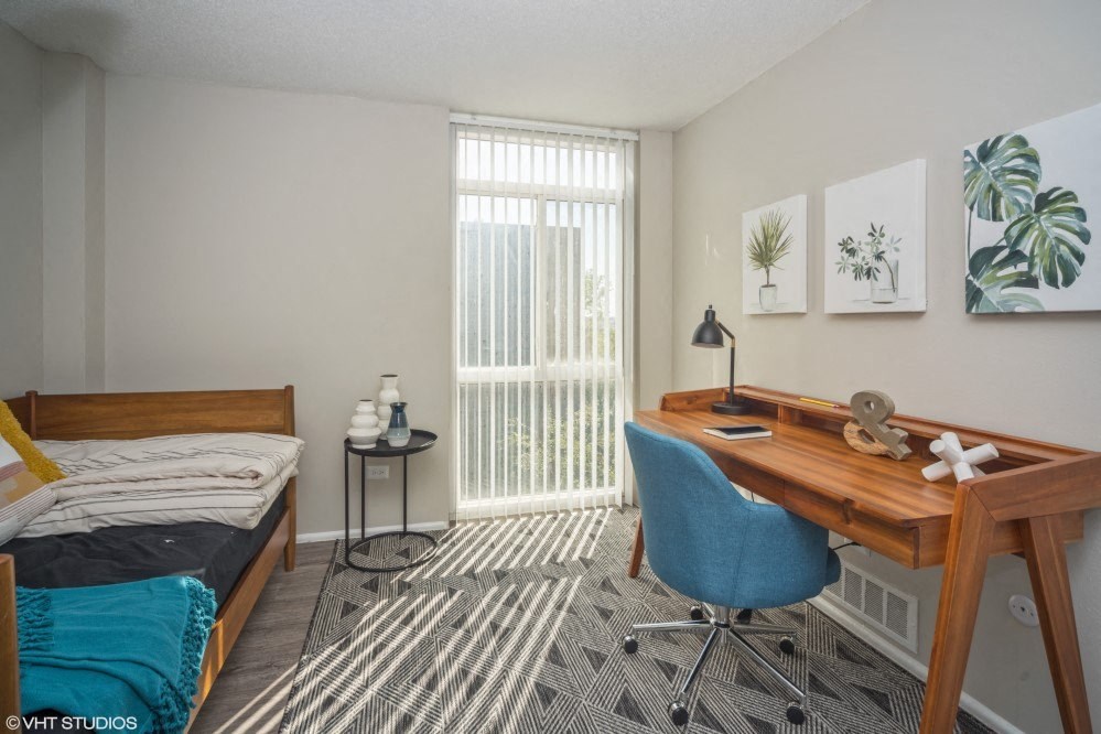 Bedroom with upgraded wood plank flooring