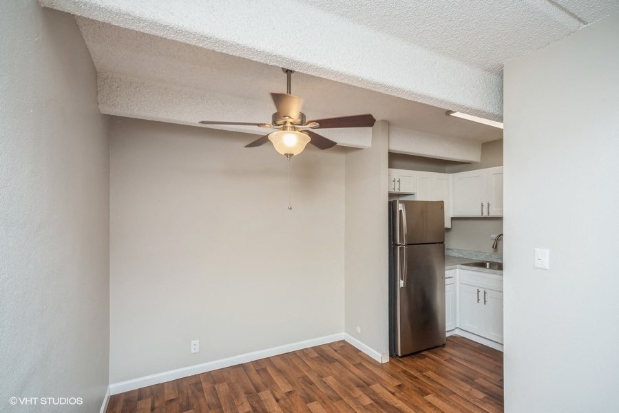 Dining area with a ceiling fan off the kitchen at 878 S Dexter St in Denver, CO