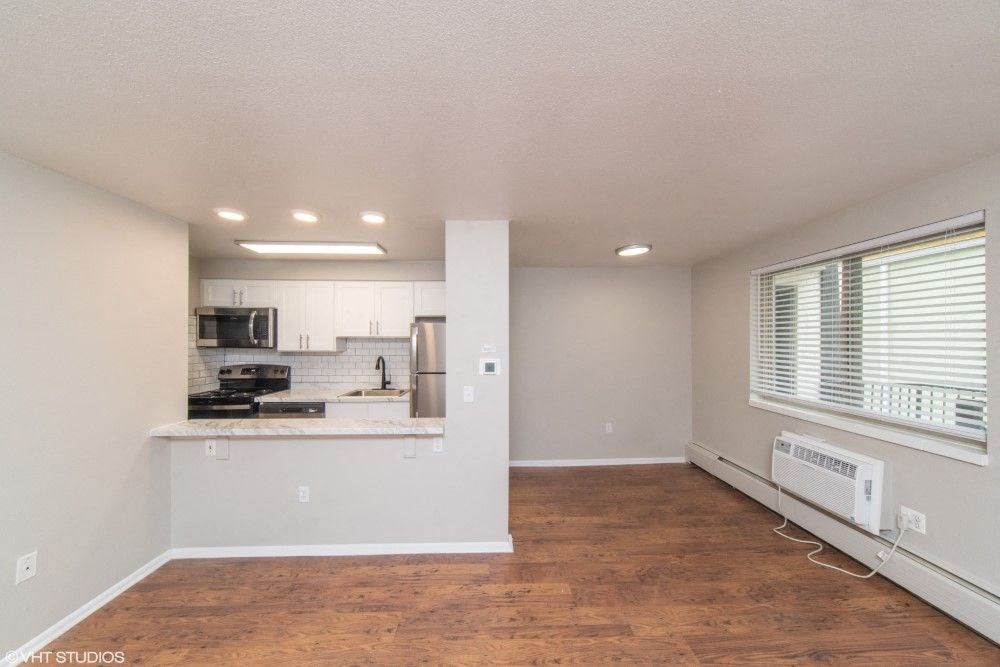 Open living area with beautiful wood flooring