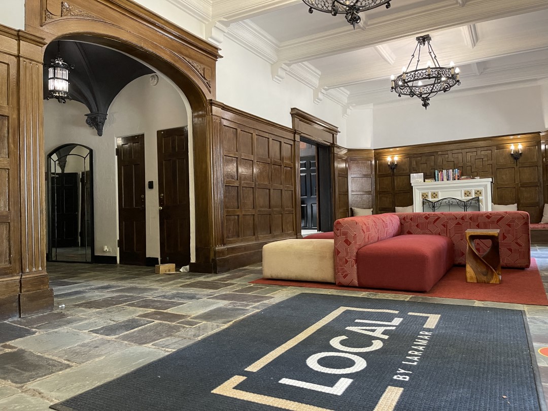 a living room with a couch and a rug on the floor