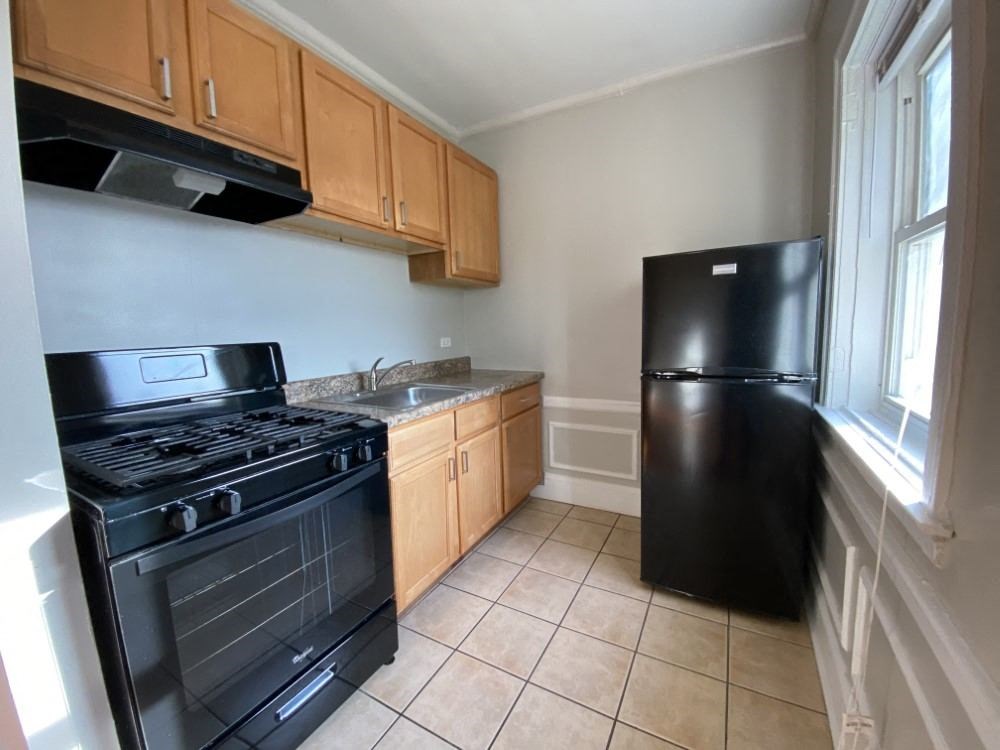 Kitchen with all black appliances - George Spoor Studio